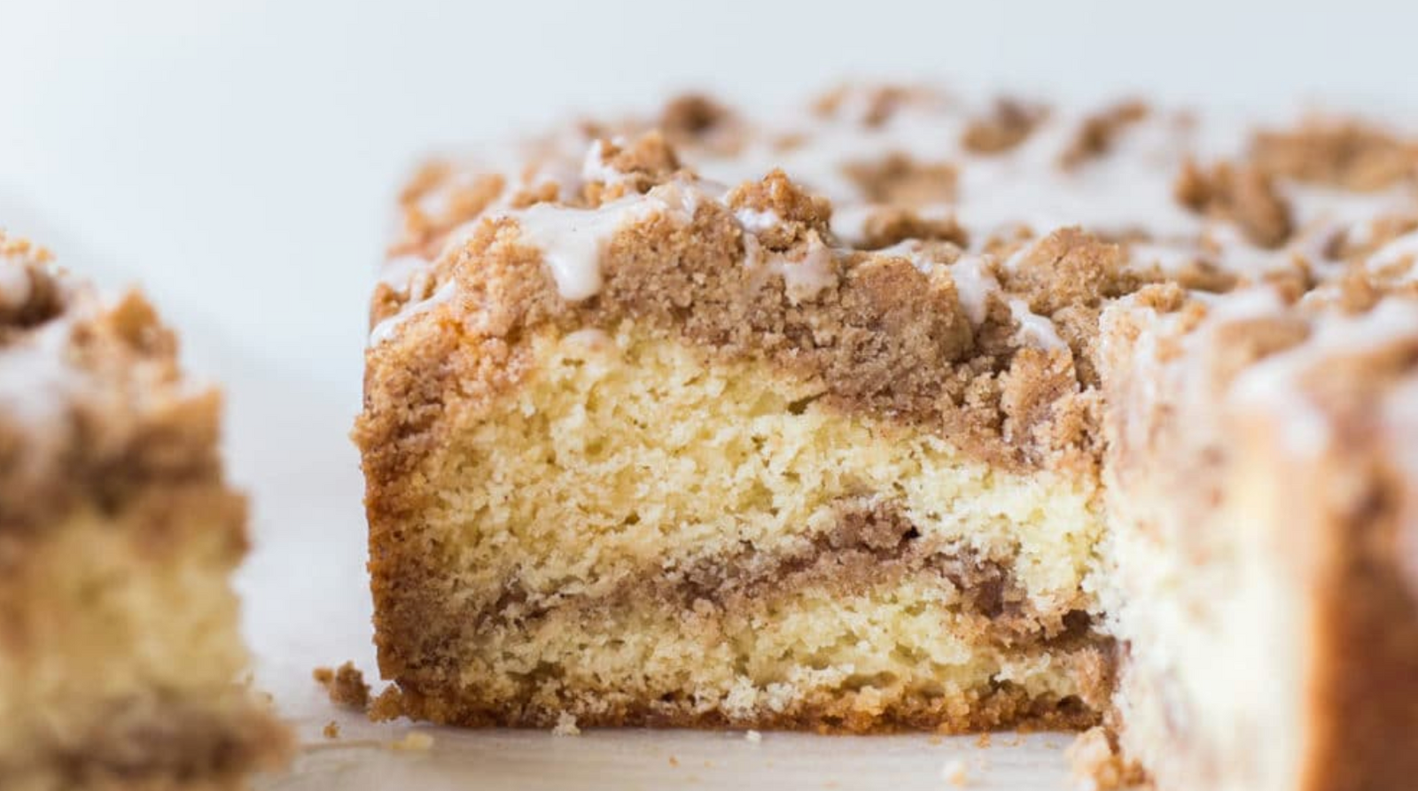 Side view of a half eaten Miss Jones cinnamon swirl coffee cake 