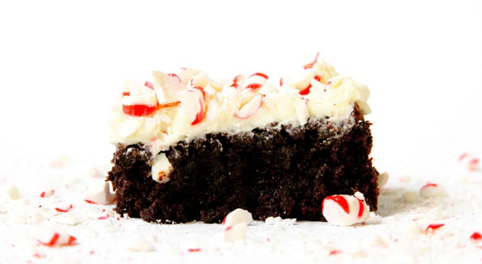 Side view of Miss Jones Baking Peppermint Bark Brownie with smashed peppermint candies